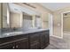Bathroom featuring a double vanity with granite counters and modern fixtures at 1806 Red Bird Cir, Concord, NC 28025
