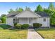Charming single story home with a welcoming front porch, manicured bushes, and a well-kept lawn at 1806 Red Bird Cir, Concord, NC 28025