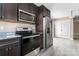 Modern kitchen featuring stainless steel appliances and plenty of cabinet storage space in a sleek design at 1806 Red Bird Cir, Concord, NC 28025