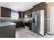 A modern kitchen featuring stainless steel appliances, ample cabinet space and a bright atmosphere at 1806 Red Bird Cir, Concord, NC 28025