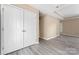 Living room boasting double closets, neutral walls, and wood-look floors at 1806 Red Bird Cir, Concord, NC 28025
