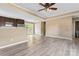 Living Room boasting an eat-in kitchen, and wood-look flooring with bright natural light at 1806 Red Bird Cir, Concord, NC 28025