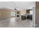 Open concept living room and kitchen featuring hardwood floors, recessed lighting, and granite countertops at 1806 Red Bird Cir, Concord, NC 28025