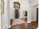 Bright foyer with hardwood floors, soaring ceilings, grand columns, and a large front door with sidelights at 18920 Peninsula Club Dr, Cornelius, NC 28031