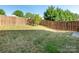 Fenced backyard featuring a lawn and landscaping, creating a private outdoor space at 2017 Beckwith Ln, Waxhaw, NC 28173