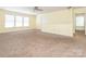 A bonus room that features neutral carpeting, multiple windows, and a ceiling fan at 2017 Beckwith Ln, Waxhaw, NC 28173