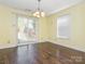 Dining area featuring wood floors and sliding door access to the backyard at 2017 Beckwith Ln, Waxhaw, NC 28173