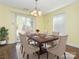 A dining room features a decorative table and chairs, plus a sliding glass door to the backyard at 2017 Beckwith Ln, Waxhaw, NC 28173