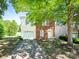 Charming two-story home with brick and vinyl siding, attached garage, and landscaped front yard at 2017 Beckwith Ln, Waxhaw, NC 28173