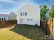 Back exterior featuring a fenced-in backyard and a well-manicured lawn at 2017 Beckwith Ln, Waxhaw, NC 28173
