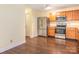 A well-equipped kitchen with stainless steel appliances and wooden cabinets at 2017 Beckwith Ln, Waxhaw, NC 28173