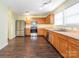 A well-equipped kitchen with stainless steel appliances, wooden cabinets and wood floors at 2017 Beckwith Ln, Waxhaw, NC 28173
