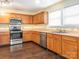 A well-equipped kitchen featuring stainless steel appliances and wood floors at 2017 Beckwith Ln, Waxhaw, NC 28173