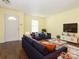 Inviting living room with modern furnishings, TV, neutral walls, and hardwood floors at 2017 Beckwith Ln, Waxhaw, NC 28173