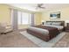 Comfortable main bedroom with a large window, ceiling fan, carpet floors and neutral paint at 2017 Beckwith Ln, Waxhaw, NC 28173