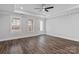 Spacious, bright bedroom with tray ceilings, wood flooring, and natural light from the window and door at 2063 Fordhill St, Rock Hill, SC 29732