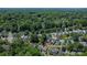 House is surrounded by trees and lush landscapes in a suburban neighborhood at 2126 Downing St, Charlotte, NC 28205