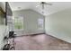 Bright bedroom with two windows, neutral paint, and ceiling fan at 2126 Downing St, Charlotte, NC 28205