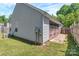 Exterior view of the home with siding, a patio, and green grass at 2126 Downing St, Charlotte, NC 28205