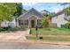 Charming single-Gathering home with a well-manicured lawn and inviting front entrance at 2126 Downing St, Charlotte, NC 28205