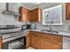 Cozy kitchen features stainless steel appliances, granite countertops, and light wood cabinetry at 2126 Downing St, Charlotte, NC 28205