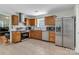 Modern kitchen featuring stainless steel appliances, granite countertops, and wood cabinets at 2126 Downing St, Charlotte, NC 28205