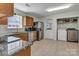 Open-concept kitchen with stainless steel appliances and a convenient laundry area at 2126 Downing St, Charlotte, NC 28205