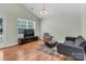 Bright living room with hardwood floors, modern furnishings, and large windows at 2126 Downing St, Charlotte, NC 28205