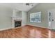 Comfortable living room with a fireplace, window and hardwood floors at 2126 Downing St, Charlotte, NC 28205