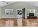 Bright living room with vaulted ceilings, hardwood floors, and an open doorway at 2126 Downing St, Charlotte, NC 28205