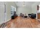 Spacious living room featuring hardwood floors, modern furnishings, and ample natural light at 2126 Downing St, Charlotte, NC 28205