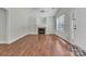 Inviting living room featuring a cozy fireplace, ample natural light, and hardwood floors at 2126 Downing St, Charlotte, NC 28205