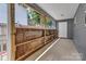 Covered porch with a view of the backyard and a door at 2126 Downing St, Charlotte, NC 28205