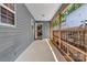 Enclosed porch featuring neutral siding and a door to the interior at 2126 Downing St, Charlotte, NC 28205