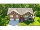 Expansive aerial view of the brick home, highlighting its architectural design and neighborhood at 221 Grayrock Dr, Statesville, NC 28677