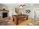 Finished basement with pool table and stone fireplace at 221 Grayrock Dr, Statesville, NC 28677