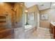 Bathroom with tiled shower, jacuzzi soaking tub, and bright natural light at 221 Grayrock Dr, Statesville, NC 28677