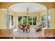 Charming breakfast nook with large windows offering views of the outdoors, tiled floor, and natural lighting at 221 Grayrock Dr, Statesville, NC 28677