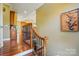 Elegant foyer featuring hardwood floors and a wrought iron staircase, creating a warm and inviting entrance at 221 Grayrock Dr, Statesville, NC 28677