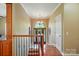 Inviting foyer with hardwood floors, an ornate chandelier, and a stained-glass window enhancing the home's elegance at 221 Grayrock Dr, Statesville, NC 28677