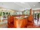 The kitchen with a large island and hardwood floors opens to the living area and has plenty of natural light at 221 Grayrock Dr, Statesville, NC 28677