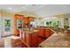 Well-equipped kitchen showcasing a large island, custom cabinetry, and stainless steel appliances at 221 Grayrock Dr, Statesville, NC 28677
