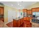 This kitchen is complete with granite island, modern appliances, hardwood floors, and ample storage at 221 Grayrock Dr, Statesville, NC 28677
