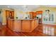 Spacious kitchen features an expansive island with granite countertops, stainless steel appliances, and hardwood floors at 221 Grayrock Dr, Statesville, NC 28677