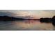 Picturesque lake at sunset with vibrant colors reflecting on the calm water at 221 Grayrock Dr, Statesville, NC 28677