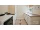 Clean laundry room with washer, dryer, sink, and storage at 221 Grayrock Dr, Statesville, NC 28677