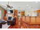 Open-concept living area featuring hardwood floors, custom built-ins, a fireplace, and a seamless flow to the kitchen at 221 Grayrock Dr, Statesville, NC 28677