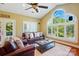 Vaulted ceilings and large windows fill the inviting living room with natural light and lush views at 221 Grayrock Dr, Statesville, NC 28677