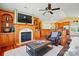 Inviting living room featuring a fireplace with built-ins and hardwood floors open to the kitchen at 221 Grayrock Dr, Statesville, NC 28677