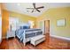 Spacious main bedroom features vaulted ceilings, hardwood floors and a bench at the foot of the bed at 221 Grayrock Dr, Statesville, NC 28677
